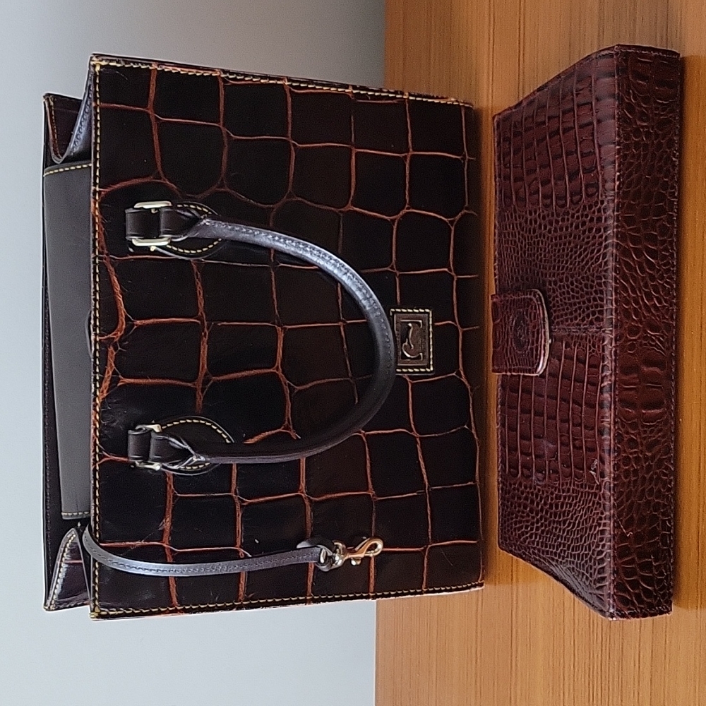 Designer's Dooney & Brooke hand bag with a free leather purse.